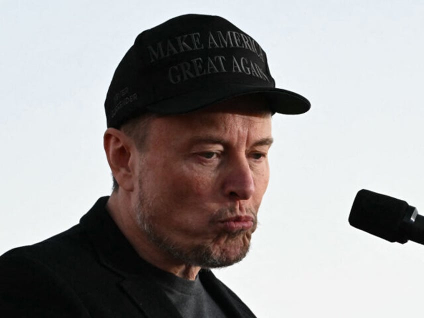 Tesla CEO Elon Musk speaks on stage during a campaign rally with former US President and R