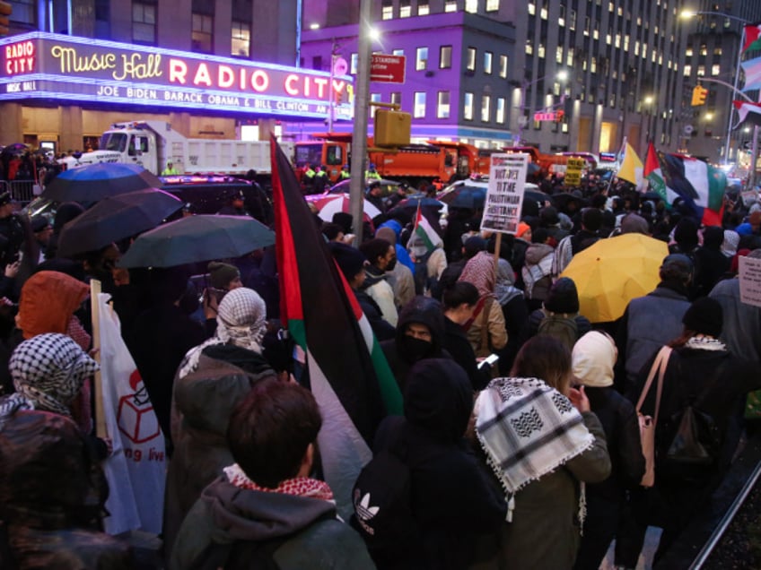 Pro-Palestinian demonstrators gather for the "Flood Manhattan for Gaza" rally outside Radio City Music Hall where US President Joe Biden is attending a fundraiser for his re-election campaign, in New York, March 28, 2024. (Photo by Leonardo Munoz / AFP) (Photo by LEONARDO MUNOZ/AFP via Getty Images)