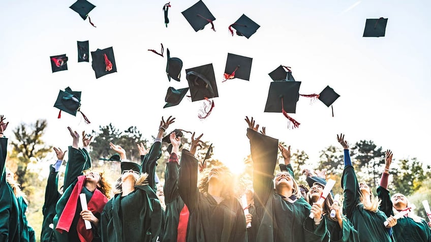 graduates throw caps