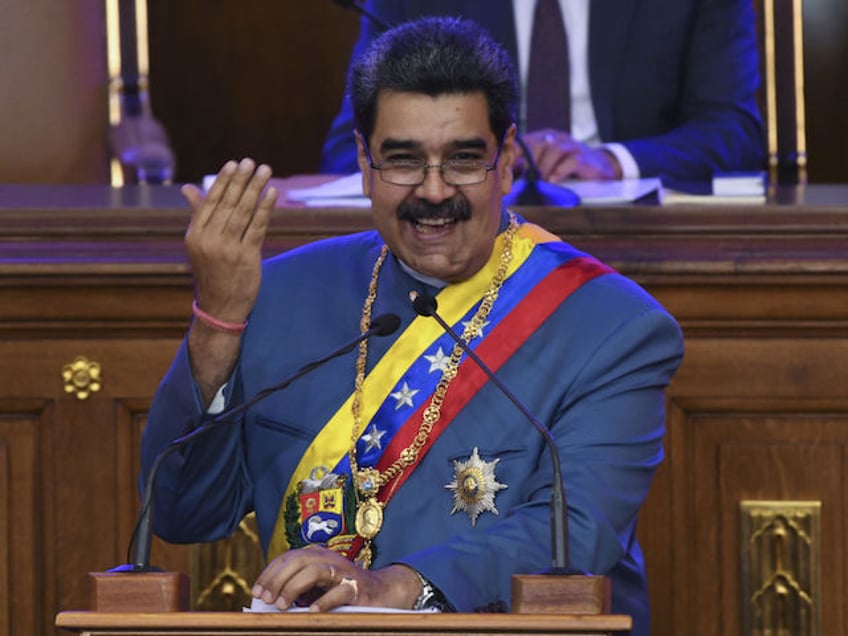 Nicolas Maduro, Venezuela's president, laugh as he delivers a State of the Union address at the National Assembly in Caracas, Venezuela, on Tuesday, Jan. 12. 2021. Maduro said during his state of the union that his government is planning to expand the use of foreign currency bank accounts held in local banks. Photographer: Carlos Becerra/Bloomberg