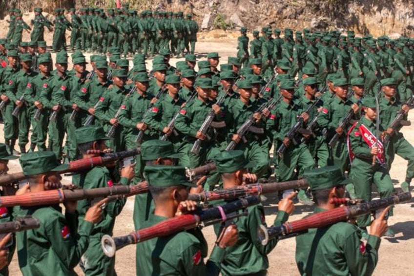 Members of the Mandalay People's Defense Forces rebel group marching in a graduation cerem