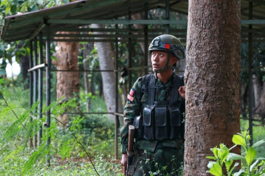 A member of the Kayan National Army (KNA) watches the sky for a potential drone strike fro