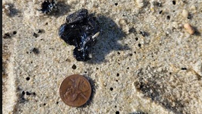 mysterious tar balls wash up on new jersey beaches