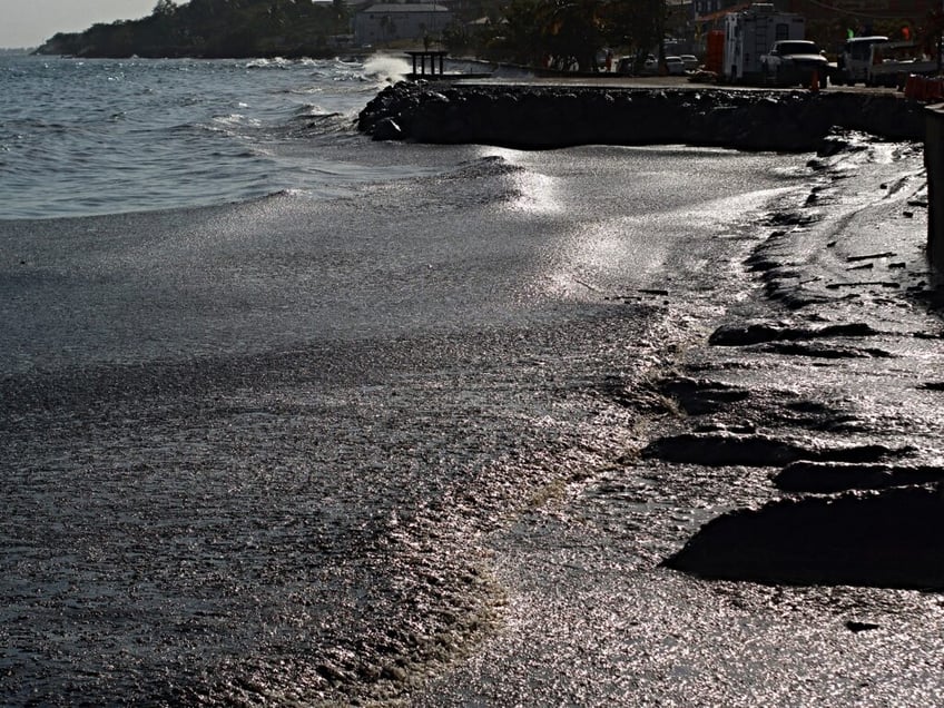 View of the oil spill at Rockly Bay in Tobago island, Trinidad and Tobago, on February 10, 2024. An oil spill caused by a mysterious ship that ran aground in the waters of Trinidad and Tobago on February 7 spread along some 15 kilometers of coastline, just when the country expects to receive thousands of tourists in the middle of the carnival season. (Photo by Clement Williams / AFP)