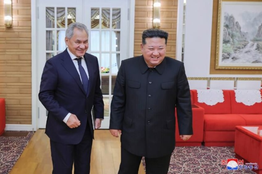 North Korean state media showed leader Kim Jong Un (R) meeting with Russia's Security Coun