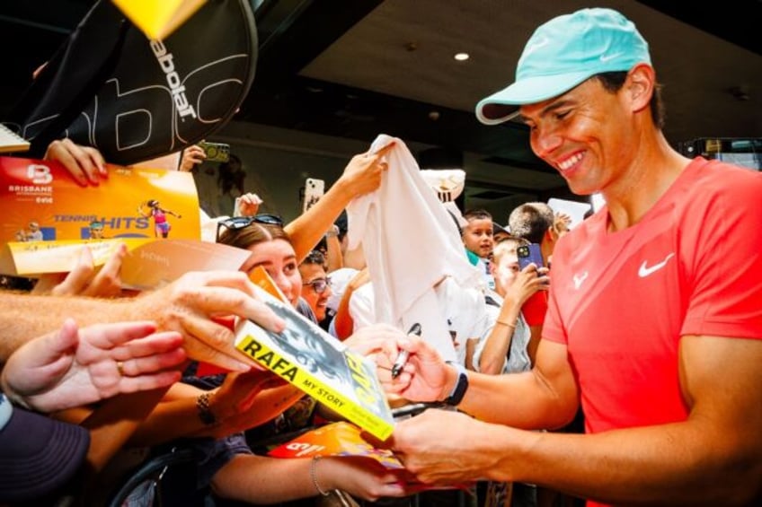 Spain's Rafael Nadal signs autographs during a promotional event ahead of the Brisbane International