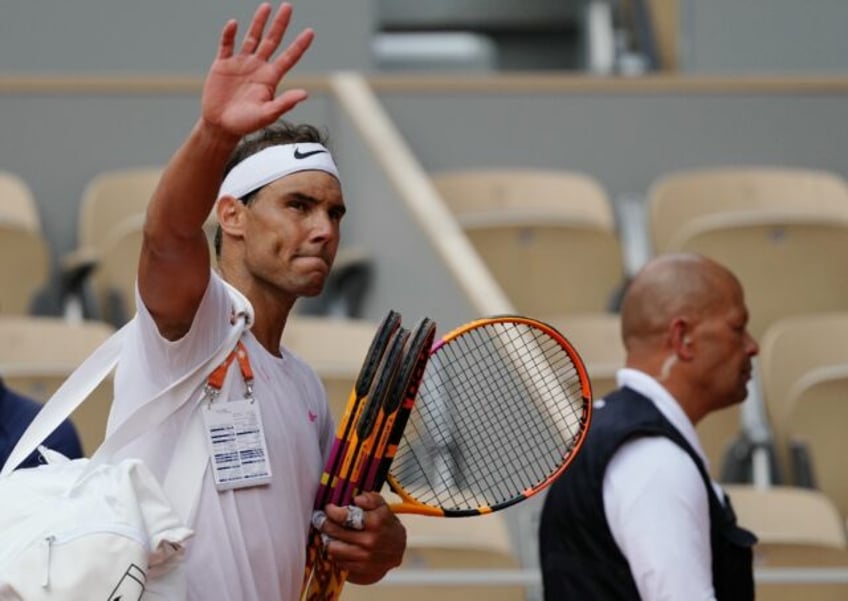 'Give my all': Rafael Nadal waves to spectators as he leaves the court after taking part i