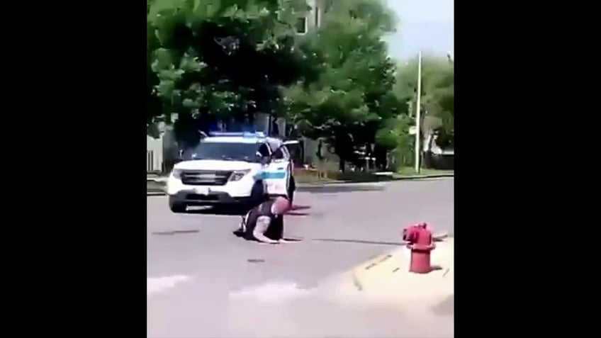 Whitley Temple drives off in a Chicago police car