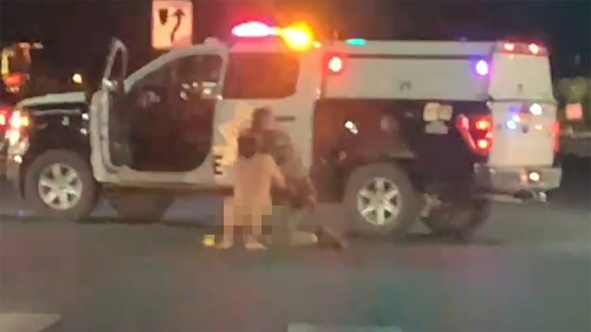 naked man tussles with las vegas cop before stealing crashing patrol car video