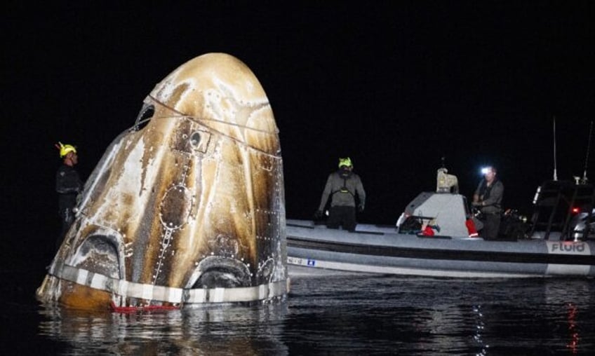 The SpaceX Dragon Endeavour spacecraft shortly after splashing down in the Gulf of Mexico