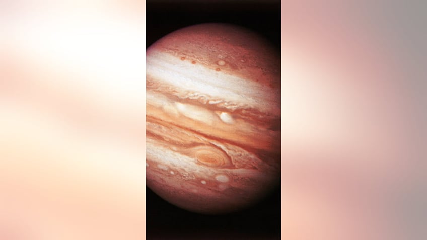 nasa spacecraft snaps face figure on jupiter during close flyby of the planet see the photos