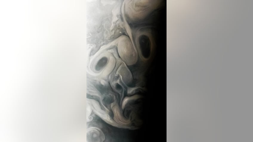 nasa spacecraft snaps face figure on jupiter during close flyby of the planet see the photos