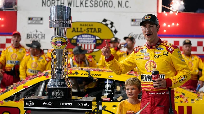 Joey Logano celebrates