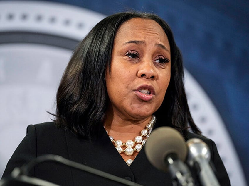 Fulton County District Attorney Fani Willis speaks during a news conference, Aug. 14, 2023