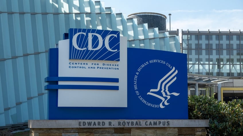 The Centers for Disease Control and Prevention sign is visible outside its Atlanta headquarters.