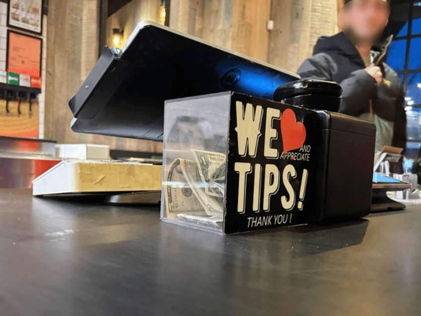 We appreciate Tips, Thank you, tips jar in Mighty Quinns BBQ restaurant, Queens, New York.