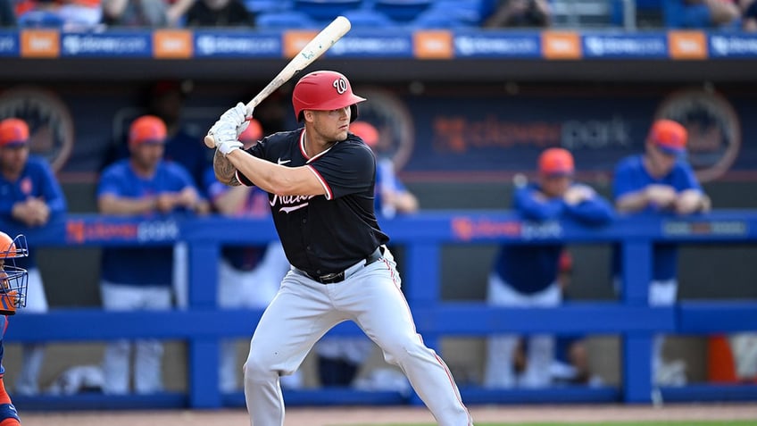 Nick Senzel bats during a game