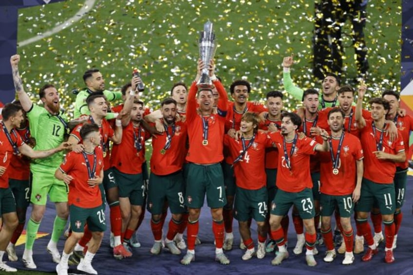 Portugal captain Cristiano Ronaldo has his team-mates behind him as he hoists the Nations