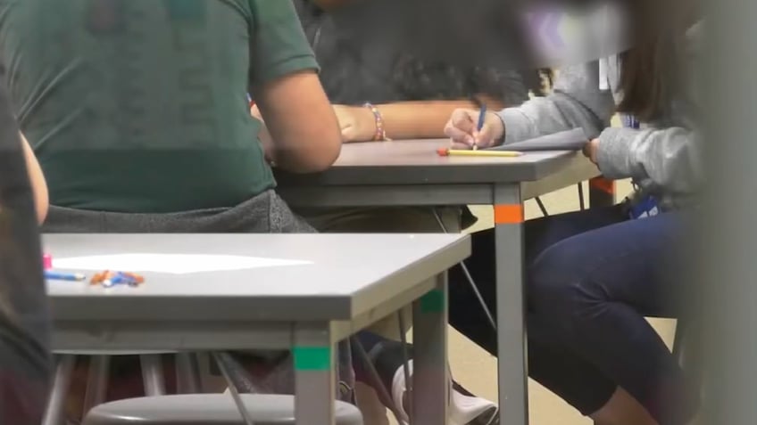 students working at a desk