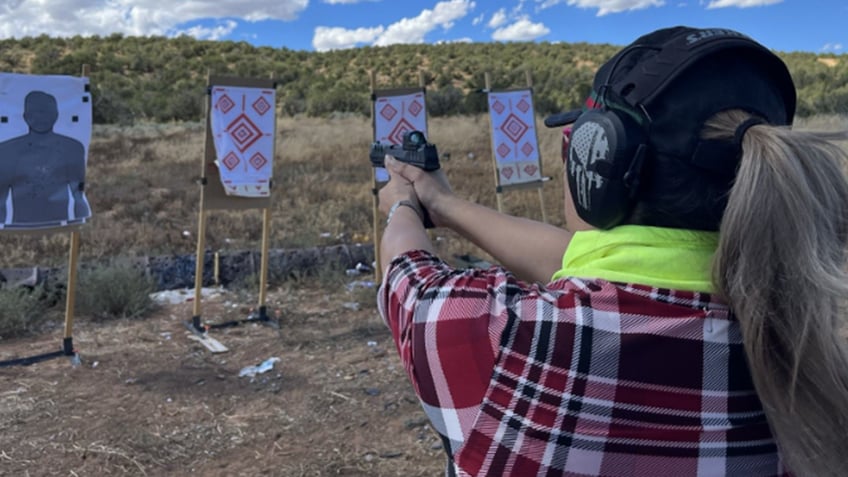 native american women taking up firearms classes for self defense refusing to be victims