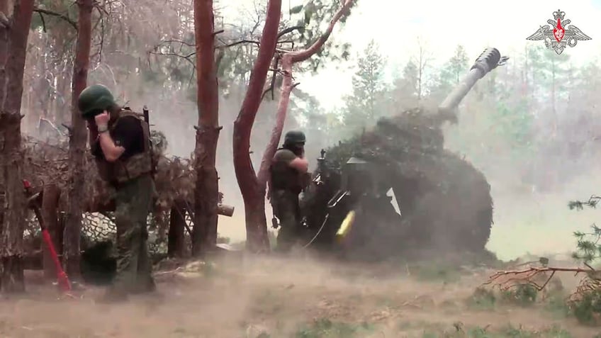 Russian soldiers fire towards Ukrainian military