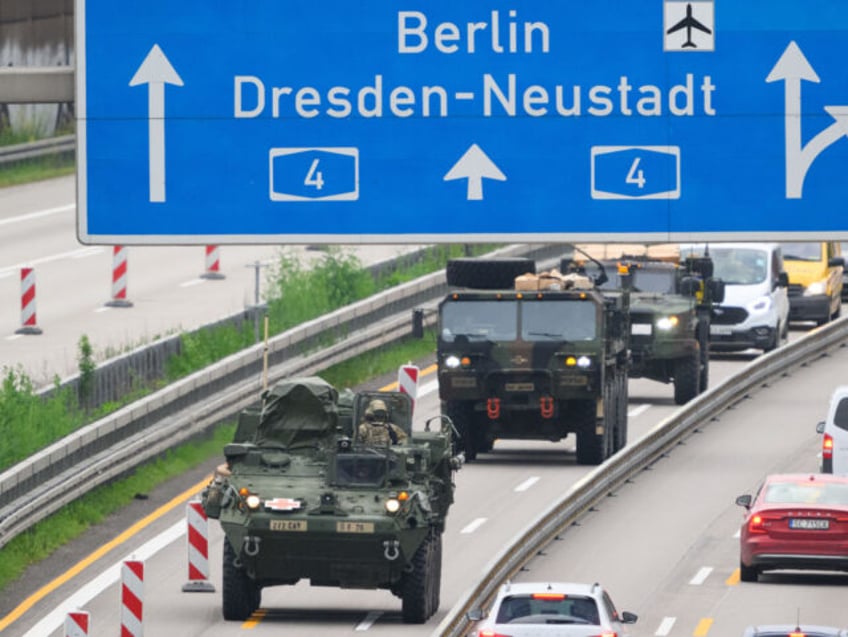 24 May 2023, Saxony, Dresden: US military vehicles drive along the A4 highway near Dresden in the morning. U.S. forces had participated in the NATO exercise "Griffin Shock" in Poland. Photo: Robert Michael/dpa (Photo by Robert Michael/picture alliance via Getty Images)