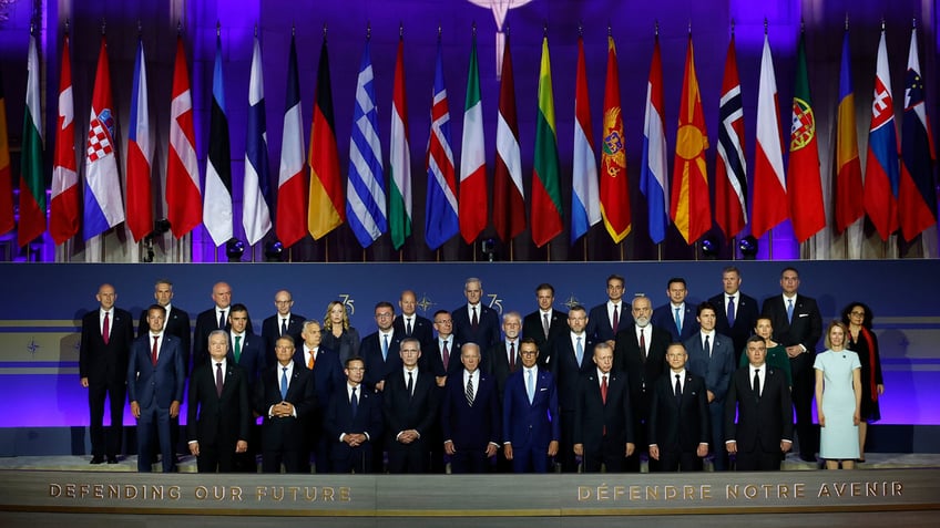 Heads of state pose for a group photo