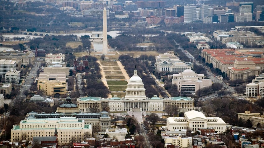 The skyline of Washington, D.C., including the U.S. Capitol building, Washington Monument, Lincoln Memorial. and National Mall, is seen from the air, Jan. 29, 2010.