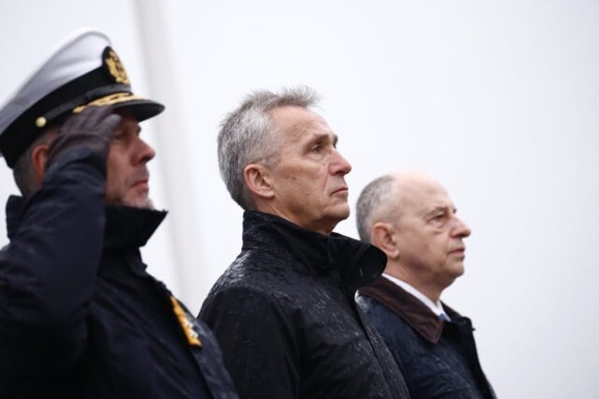 NATO Secretary General Jens Stoltenberg (C), flanked by the Chair of NATO's Military Commi