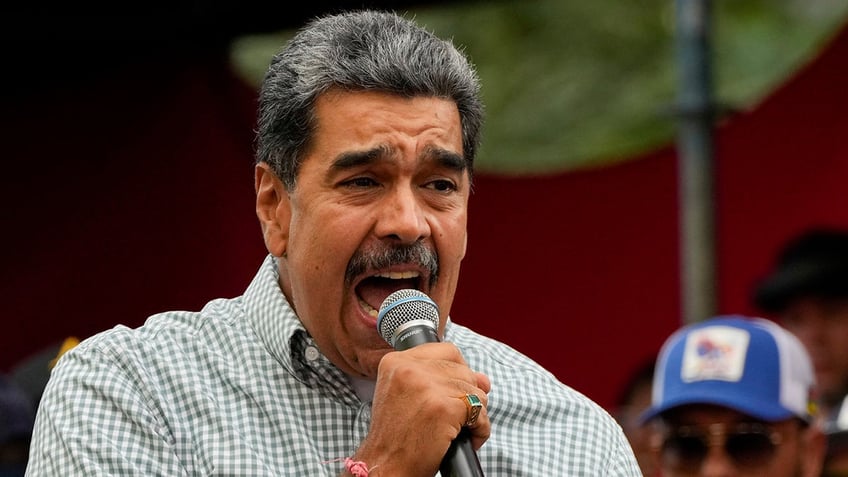 Maduro speaking into a microphone