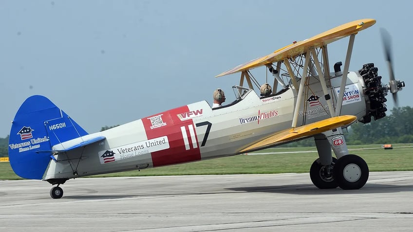 navy veteran airman age 100 flies again on vintage world war ii pilot training biplane