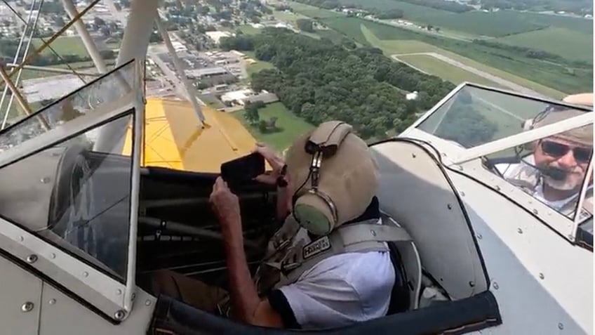 navy veteran airman age 100 flies again on vintage world war ii pilot training biplane