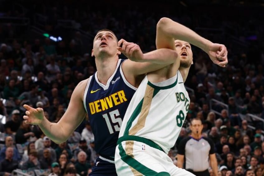 Denver's Nikola Jokic, left, battled for position under the basket with Boston's Kristaps