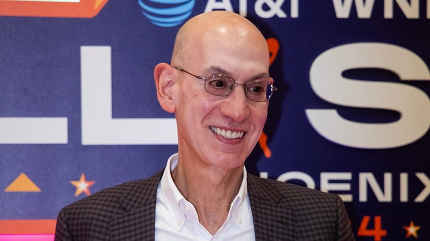 Adam Silver smiles