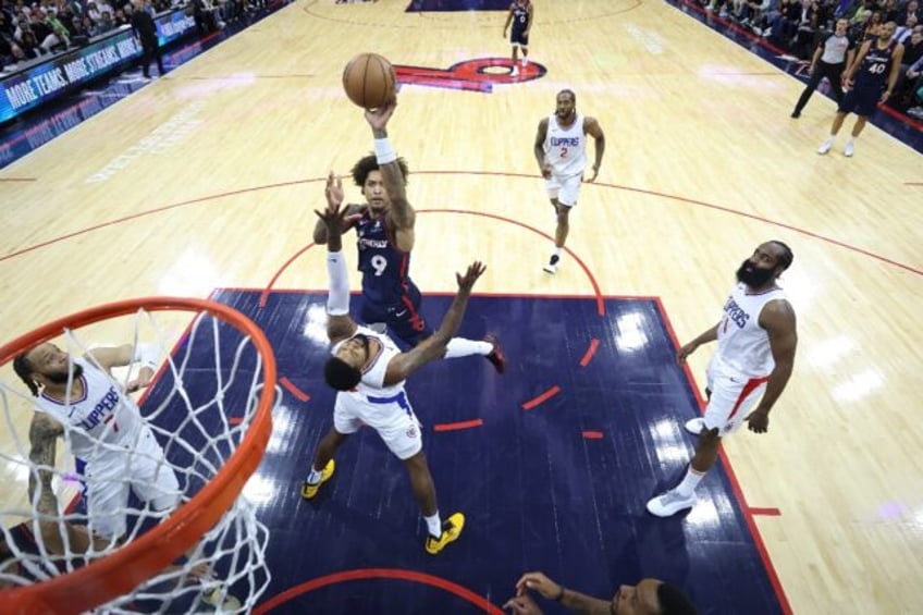Philadelphia's Kelly Oubre Jr., shooting over Paul George of the Los Angeles Clippers, was