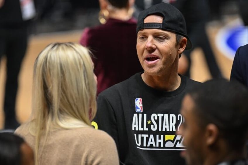 NBA Utah Jazz owner Ryan Smith, at right talking with US ski racer Lindsey Vonn, has asked the NHL to begin an expansion process for a team in Salt Lake City after years of discussing the prospect with NHL officials