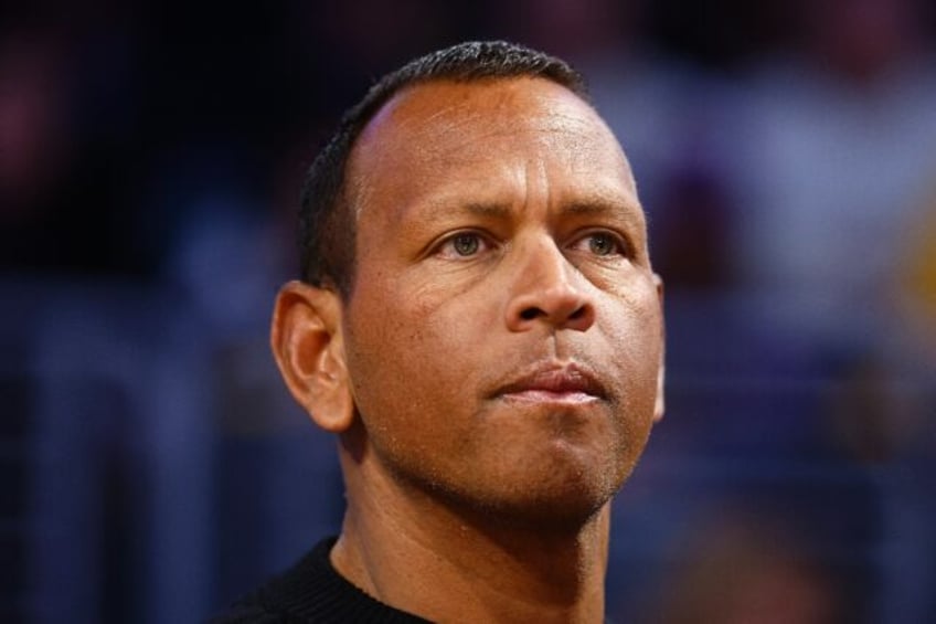 Retired Major League Baseball star Alex Rodriguez, watching a Minnesota Timberwolves NBA g