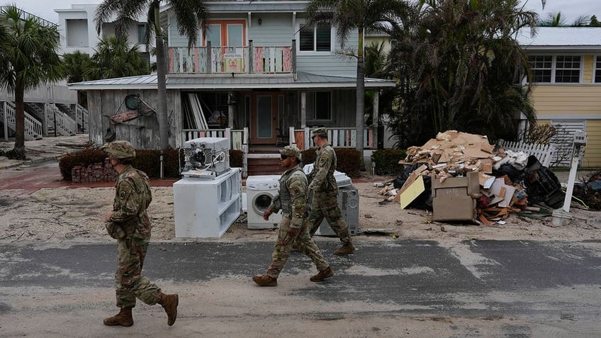 National Guard members walk