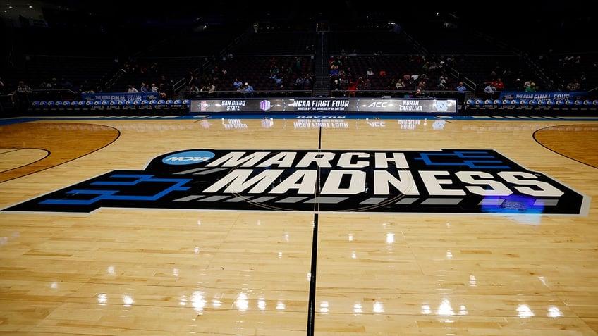 March Madness logo on court