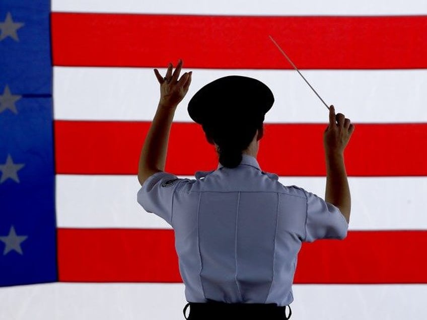 Conductor Heather Pickett directs the band during an Independence Day concert by the Ameri