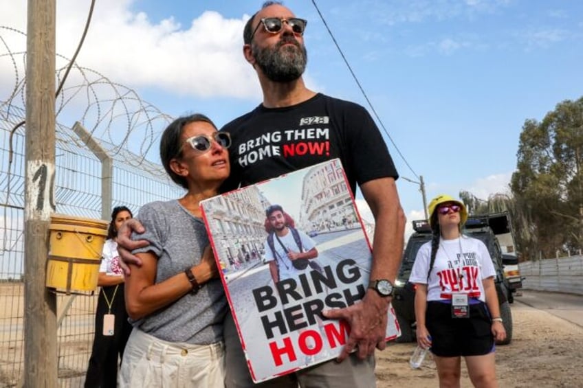 Rachel Goldberg-Polin and her husband Jonathan attend a demonstration near Kibbutz Nirim b