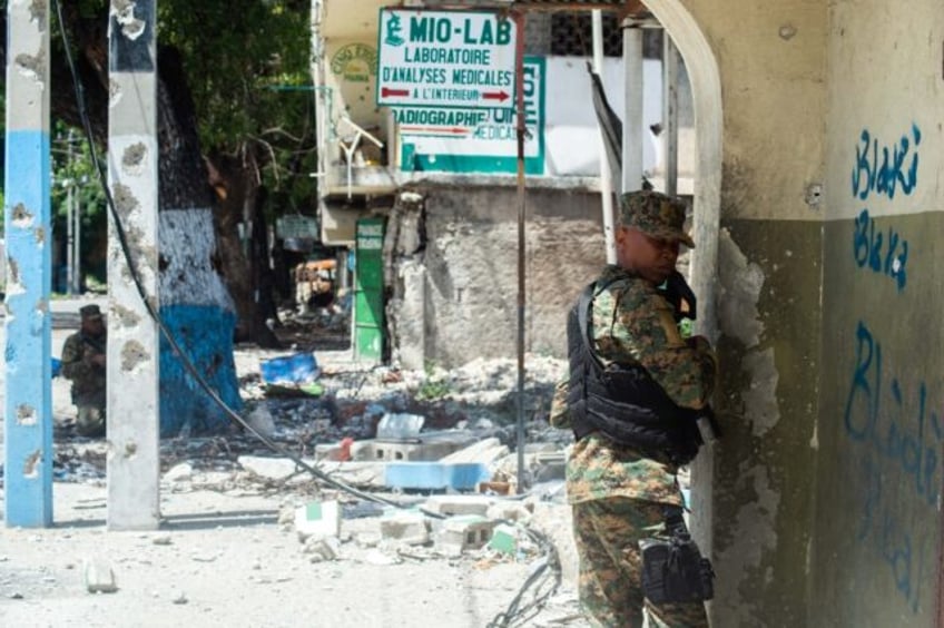 Police forces take part in an operation against powerful gangs in the city center near the