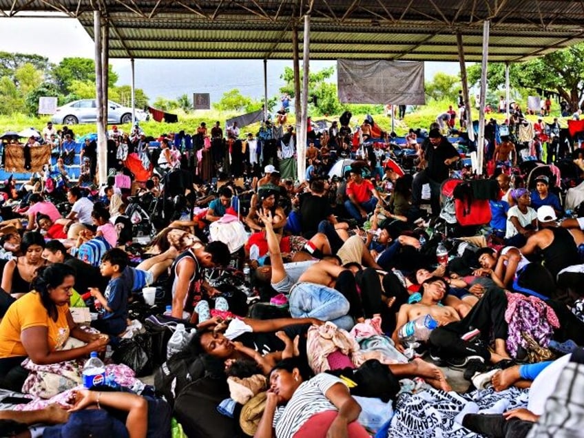 Migrants, mostly from Central America and Venezuela, rest on their way to the United State