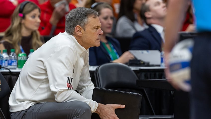 John Cook looks on during a game