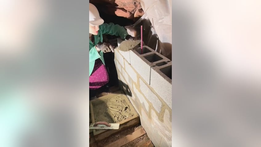 Tunnel Girl digs beneath her home in Herndon, Virginia.