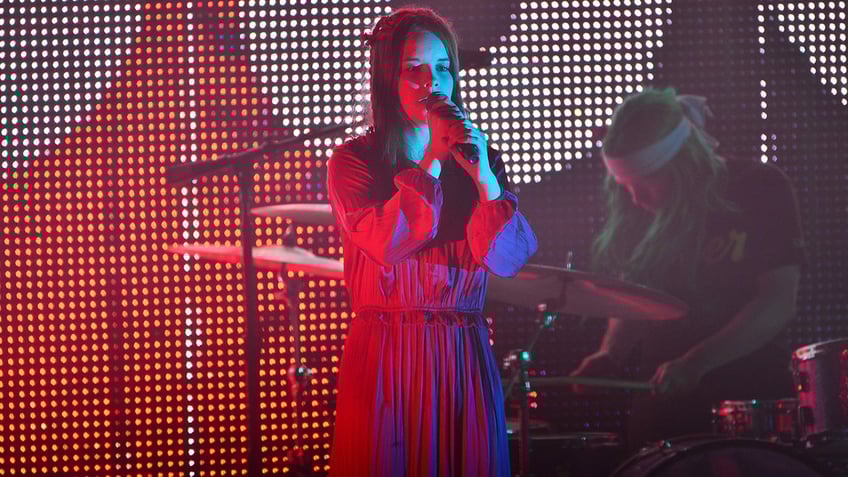 Nell Smith singing on stage