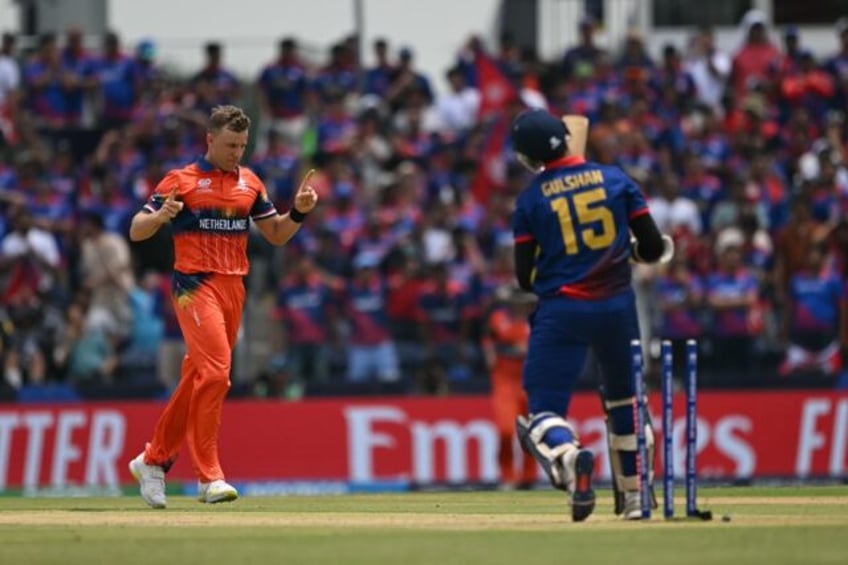 Netherland's Bas de Leede celebrates taking the wicket of Nepal's Gulsan Jha in their T20