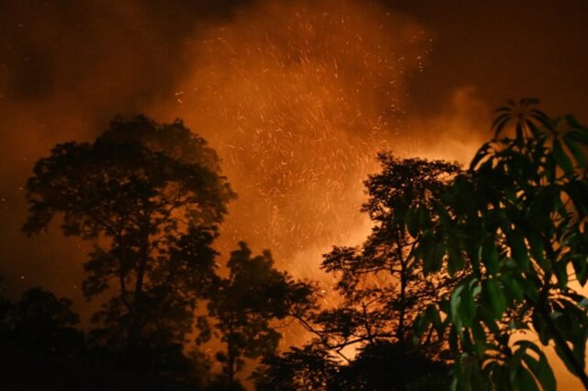 A wild fire burns near the village of Lubhu in Lalitpur district, on the outskirts of Kath