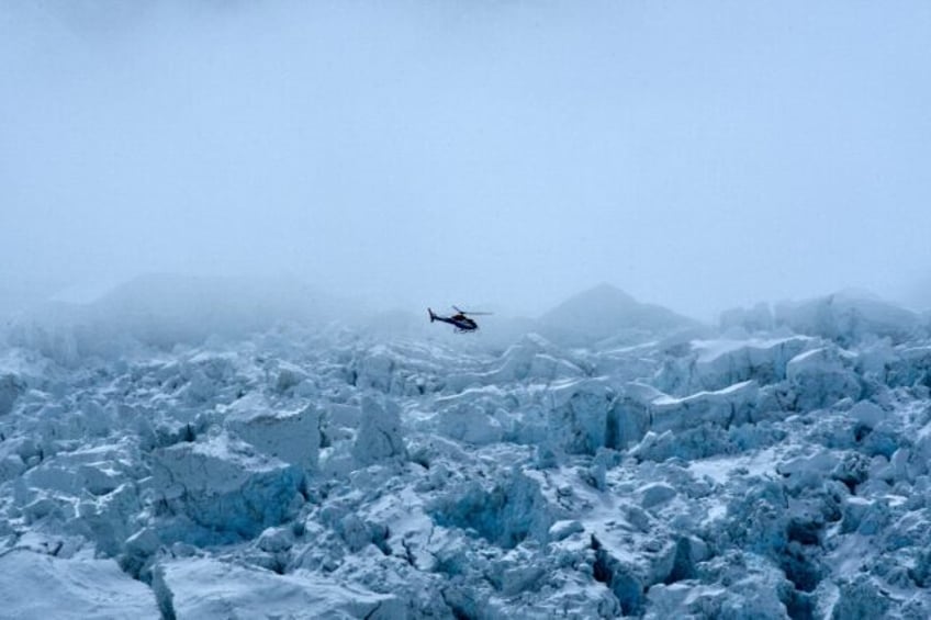 A helicopter flies over Mount Everest on May 2, 2021