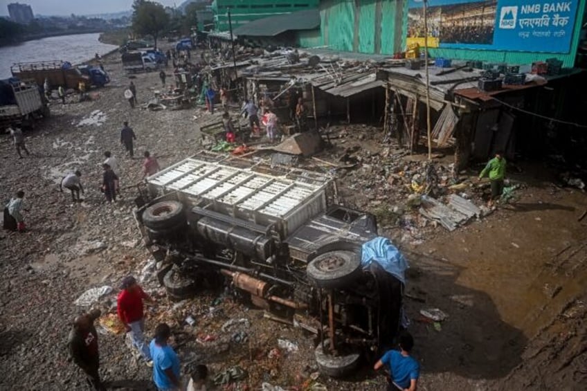 Entire neighbourhoods in Kathmandu were inundated after the heaviest rains in more than tw